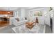 Open-concept living room with lots of natural light and direct view of dining area at 10933 E 115Th Pl, Commerce City, CO 80640