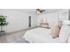 Bright and spacious bedroom featuring a ceiling fan and large windows for natural light, creating a serene retreat at 10933 E 115Th Pl, Commerce City, CO 80640