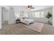 Airy bedroom with ceiling fan, ample natural light, and neutral decor creating a peaceful and inviting space at 10933 E 115Th Pl, Commerce City, CO 80640