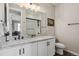 Bathroom featuring a white vanity with a granite countertop and modern fixtures at 1925 Peregrine Dr, Brighton, CO 80601