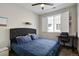 Bedroom with desk, and large window with white blinds at 1925 Peregrine Dr, Brighton, CO 80601