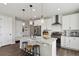 Gourmet kitchen featuring granite countertops, stainless appliances, and a breakfast bar island at 1925 Peregrine Dr, Brighton, CO 80601