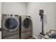 Laundry room featuring modern washer and dryer set at 1925 Peregrine Dr, Brighton, CO 80601