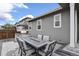 Inviting outdoor dining area featuring a built-in grill and comfortable seating for alfresco meals at 1925 Peregrine Dr, Brighton, CO 80601