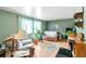 Cozy living room with bright natural light, laminate flooring, comfortable seating, and decorative accents at 6994 W Hinsdale Dr, Littleton, CO 80128