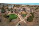 Aerial view of a sprawling estate with manicured lawns, mature trees, and a private putting green at 4691 Bandera Pl, Parker, CO 80134