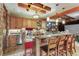 Basement wet bar with granite countertop and seating at 4691 Bandera Pl, Parker, CO 80134