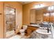 Basement bathroom with double vanity and walk-in shower at 4691 Bandera Pl, Parker, CO 80134
