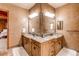 Bathroom boasts double vanity and corner granite at 4691 Bandera Pl, Parker, CO 80134