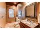 Elegant powder room with granite vanity and tiled floor at 4691 Bandera Pl, Parker, CO 80134