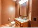 Stylish bathroom with granite vanity and a brown-toned color scheme at 4691 Bandera Pl, Parker, CO 80134