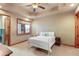Bright bedroom featuring a white metal bed frame and neutral decor at 4691 Bandera Pl, Parker, CO 80134