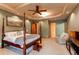 Spacious basement bedroom with king-size bed and sitting area at 4691 Bandera Pl, Parker, CO 80134