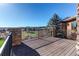 Inviting deck featuring stone pillars, iron railing and stunning views of the lush green golf course at 4691 Bandera Pl, Parker, CO 80134