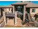 Multi-level home featuring stone accents, spacious balconies, and an expansive outdoor living area at 4691 Bandera Pl, Parker, CO 80134