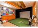Home golf simulator room with projector and turf at 4691 Bandera Pl, Parker, CO 80134