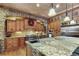 Island kitchen with granite countertops and stainless steel appliances at 4691 Bandera Pl, Parker, CO 80134