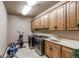 Laundry room with extra space for fitness equipment at 4691 Bandera Pl, Parker, CO 80134
