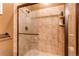 Large walk-in shower with tiled walls at 4691 Bandera Pl, Parker, CO 80134