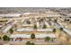 Aerial view of a residential community near shopping, highlighting the ample parking and landscaping at 5721 W 92Nd Ave # 53, Westminster, CO 80031