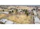 High-angle shot displays a neighborhood with modern townhomes, mature trees, and a central playground at 5721 W 92Nd Ave # 53, Westminster, CO 80031