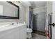 Bathroom featuring a single sink vanity and a tiled shower with glass doors at 5721 W 92Nd Ave # 53, Westminster, CO 80031