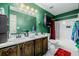 Bathroom featuring a double sink vanity, mirror, and shower-tub combination at 5721 W 92Nd Ave # 53, Westminster, CO 80031