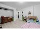 Bedroom view with wood-look floors, a dresser, and natural light at 5721 W 92Nd Ave # 53, Westminster, CO 80031