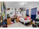 Bedroom with unique decor, a desk, and a mix of plush and artistic elements at 5721 W 92Nd Ave # 53, Westminster, CO 80031