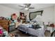 Bedroom featuring a ceiling fan, window, and assorted furniture and belongings at 5721 W 92Nd Ave # 53, Westminster, CO 80031