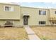 Inviting exterior featuring a well-manicured lawn and a welcoming entrance to the townhome at 5721 W 92Nd Ave # 53, Westminster, CO 80031