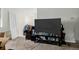 Living room featuring a TV and carpet flooring perfect for entertaining at 5721 W 92Nd Ave # 53, Westminster, CO 80031
