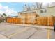 Assigned parking spaces available in front of a fenced home with mature trees at 5721 W 92Nd Ave # 53, Westminster, CO 80031