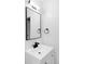 Updated bathroom with a modern vanity, stylish mirror, and sleek black fixtures at 9380 Raleigh Ct, Westminster, CO 80031