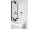 Bathroom vanity featuring clean lines, a black faucet, and a large mirror at 9380 Raleigh Ct, Westminster, CO 80031