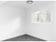 Bright bedroom with plush carpet, white walls, white trim, and a window view at 9380 Raleigh Ct, Westminster, CO 80031