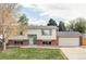 Charming two-story home features a manicured lawn, brick accents and attached two car garage at 9380 Raleigh Ct, Westminster, CO 80031