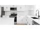 Bright kitchen featuring white cabinetry, stainless steel appliances and quartz countertops at 9380 Raleigh Ct, Westminster, CO 80031