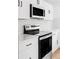 Bright kitchen showcasing modern appliances, sleek countertops, and white cabinetry for a clean aesthetic at 9380 Raleigh Ct, Westminster, CO 80031