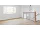 Open room with lots of natural light, modern lighting, and black metal railing at 9380 Raleigh Ct, Westminster, CO 80031