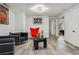 Spacious finished basement featuring a modern lighting fixture at 1498 S Perry St, Denver, CO 80219