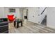 Finished basement featuring an accent chair and decorative art at 1498 S Perry St, Denver, CO 80219