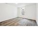 Room with luxury vinyl plank flooring, one window and a floral print yoga mat at 1498 S Perry St, Denver, CO 80219