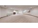 Expansive basement featuring a fireplace, plenty of room for entertaining, and access to an upper level at 3299 S Newcombe St, Lakewood, CO 80227