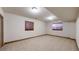 Finished basement featuring neutral carpet, recessed lighting, and window wells at 3299 S Newcombe St, Lakewood, CO 80227