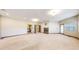 Expansive basement with a fireplace, multiple access points, and potential for various entertainment options at 3299 S Newcombe St, Lakewood, CO 80227
