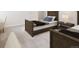 Well-lit bedroom features neutral walls, plush carpeting, matching bed sets, and plenty of space for relaxation at 3299 S Newcombe St, Lakewood, CO 80227