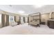 Well-lit bedroom with a four-poster bed, sitting area, and ample natural light at 3299 S Newcombe St, Lakewood, CO 80227