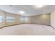Large carpeted bonus room with multiple windows providing ample sunlight at 3299 S Newcombe St, Lakewood, CO 80227
