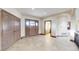 Inviting entryway featuring wood door, closet, and tile flooring at 3299 S Newcombe St, Lakewood, CO 80227